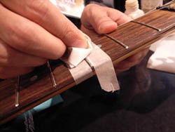 Apply masking tape prior to polishing a fret