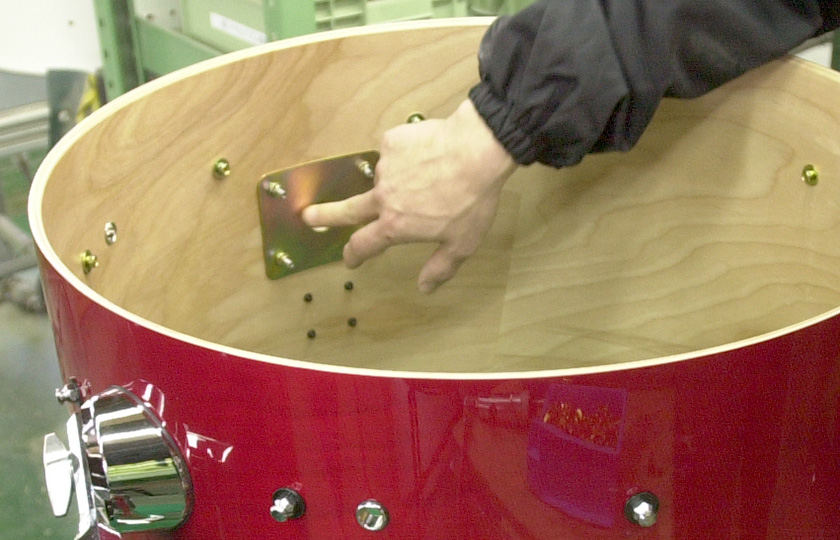 Attaching hardware to a bass drum