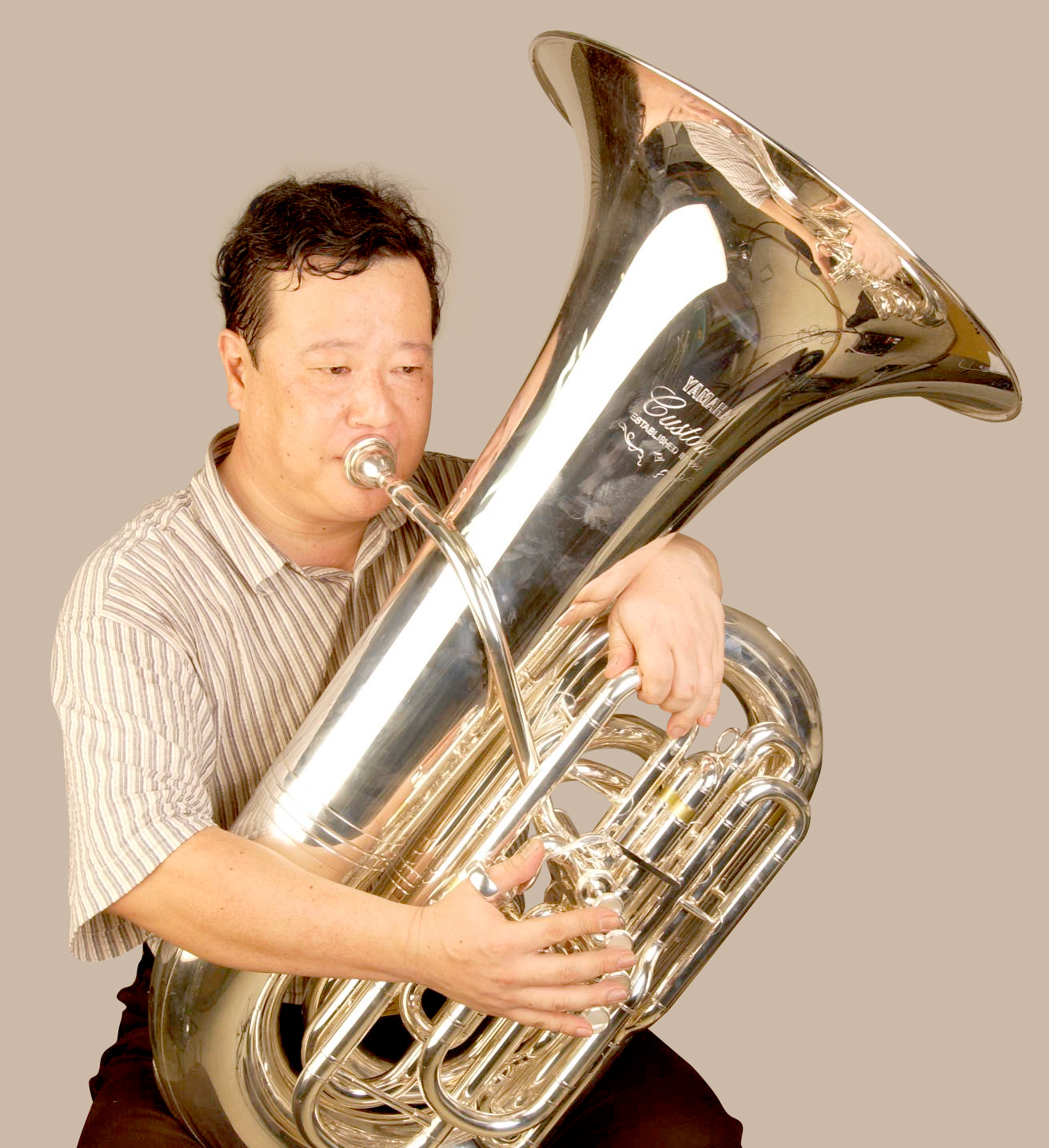 Front-action tubas have the bell on the player's left side