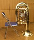 Use a chair to support the tuba