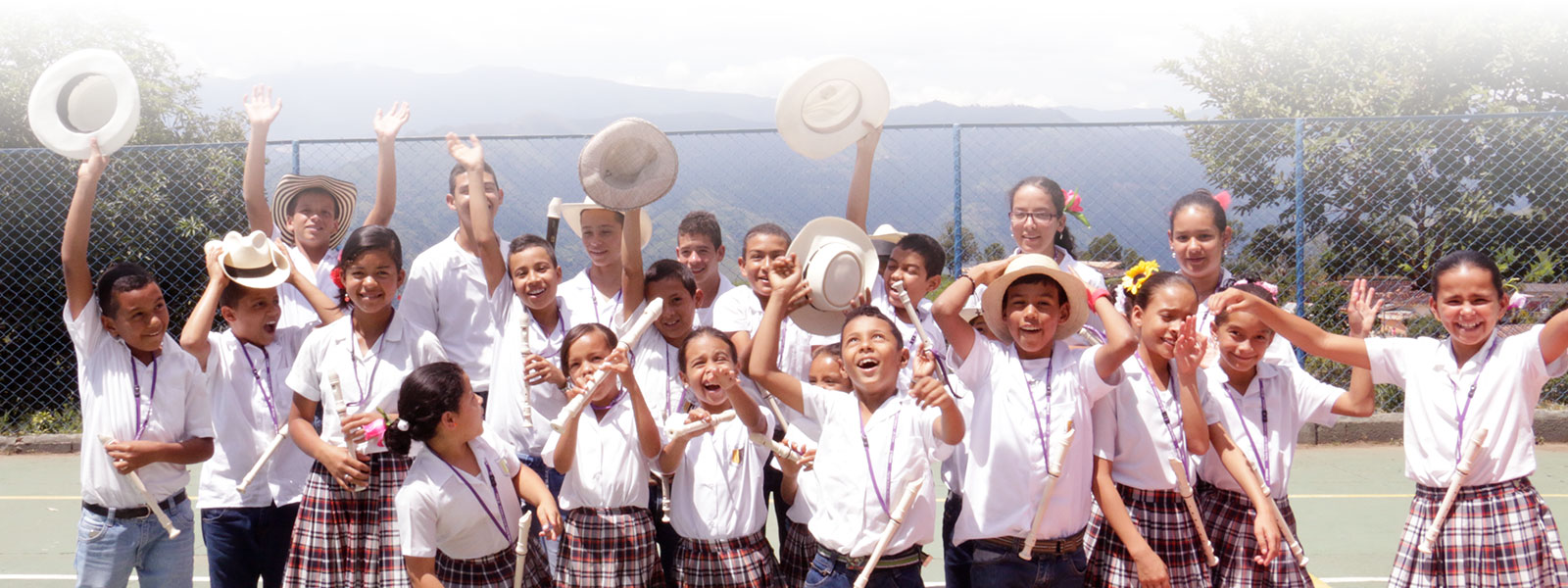 [Image] Children waving with smiles, symbolizing hope for the future