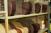 Guitar tops and backs stacked in rows