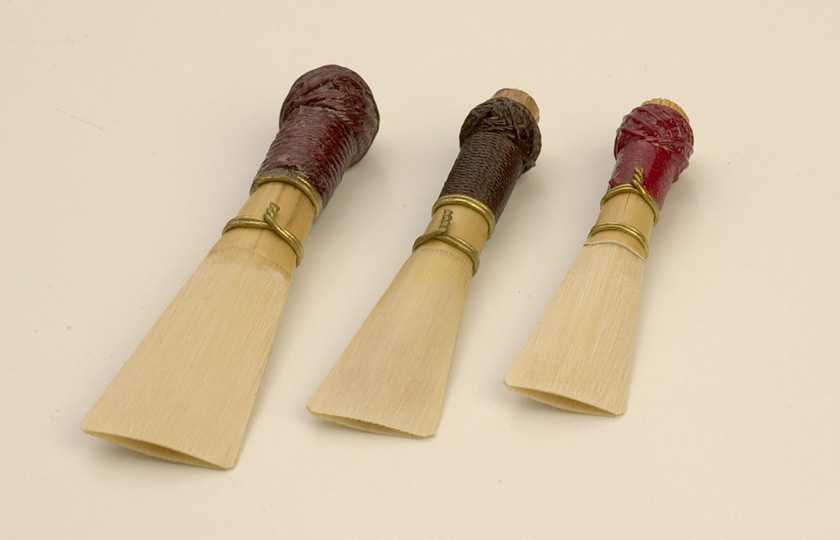 From the left, the reeds of a contrabassoon, a basson, and a bassoon