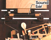 A sound bar being struck by a hammer