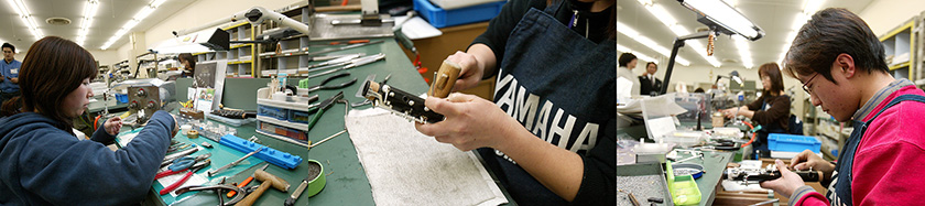Workplace where clarinets are assembled. The bench is crowded with intricate parts and tools.