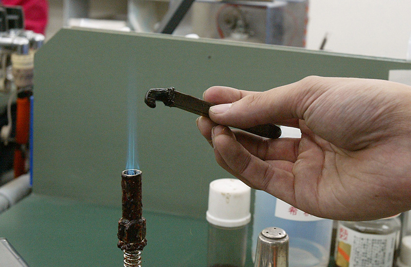 A blue flame on every workbench for heating the adhesive