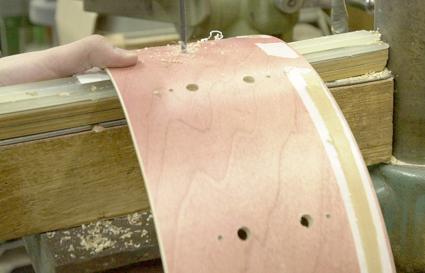 Opening holes. The grain of the wood was used to give this drum a vintage finish.