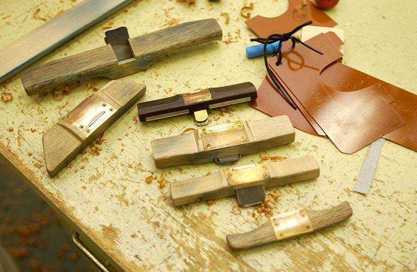 Handmade planes; on the bottom right is the gauge used to check the shape of the guitar
