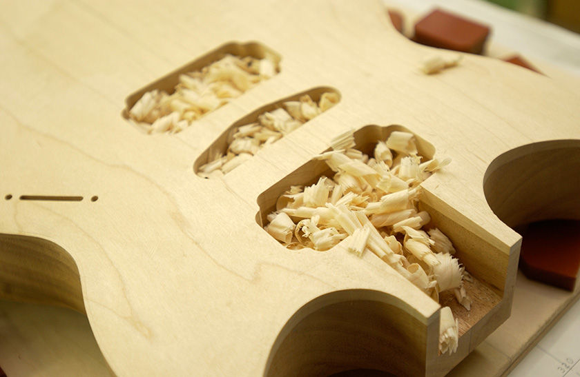The luthier finally shaves the area around the surface by hand
