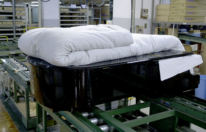 Pianos for customers in Japan are wrapped in heavy padded blankets