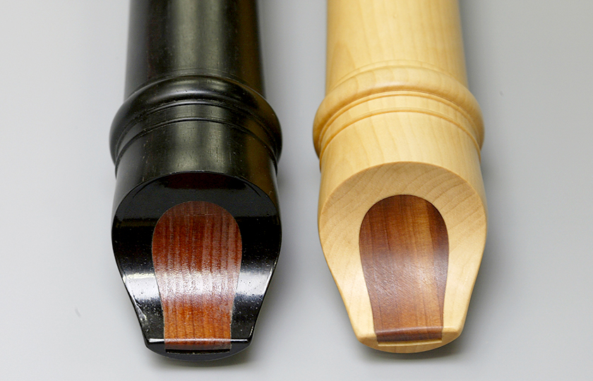 Recorders made from ebony, left, and Japanese boxwood (Buxus microphylla var. japonica), right. The blocks in both recorders are made from red cedar