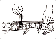 Use a tone hole cleaner to remove dirt and small particles from between the keys, being careful not to damage the pads.