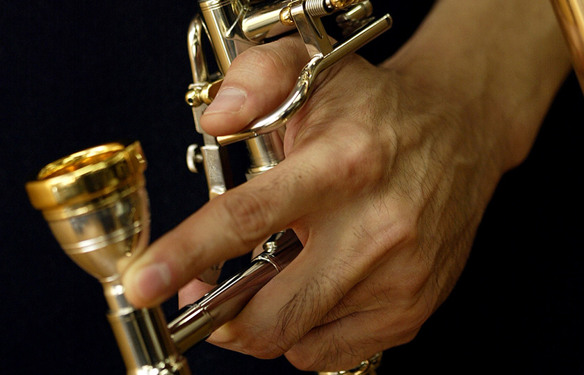 Install the mouthpiece to a trombone