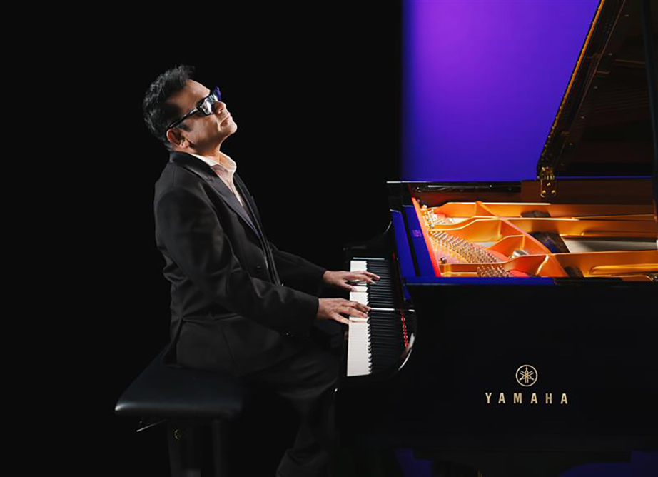 [ Image ] A.R. Rahman with the Yamaha CFX, the company’s flagship concert grand piano