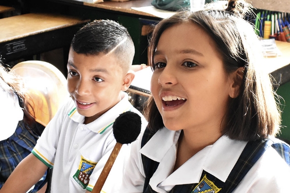 [Image] Colombian children speaking up in a music class