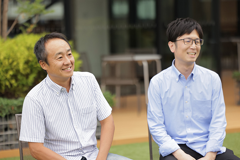 [Image] Photograph of developers in an interview