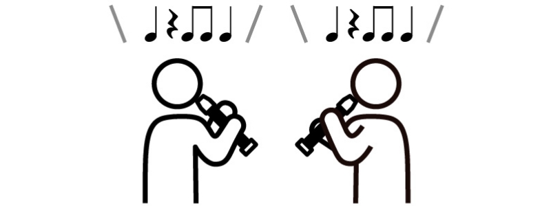 [画像] 向かい合ってリコーダーを演奏する児童たち