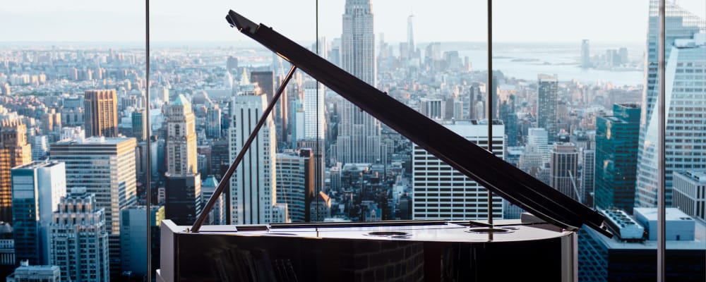 avantgrand piano in a cityscape background
