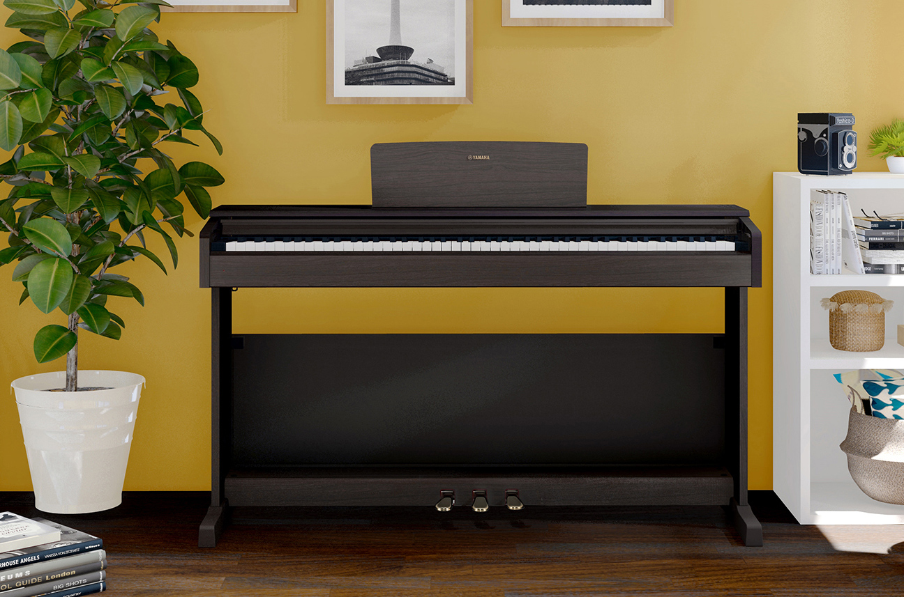 lifestyle shot photo of arius piano in a room with yellow background