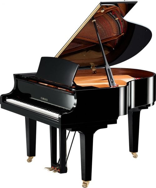 Yamaha baby grand piano with lid open viewed from right side.