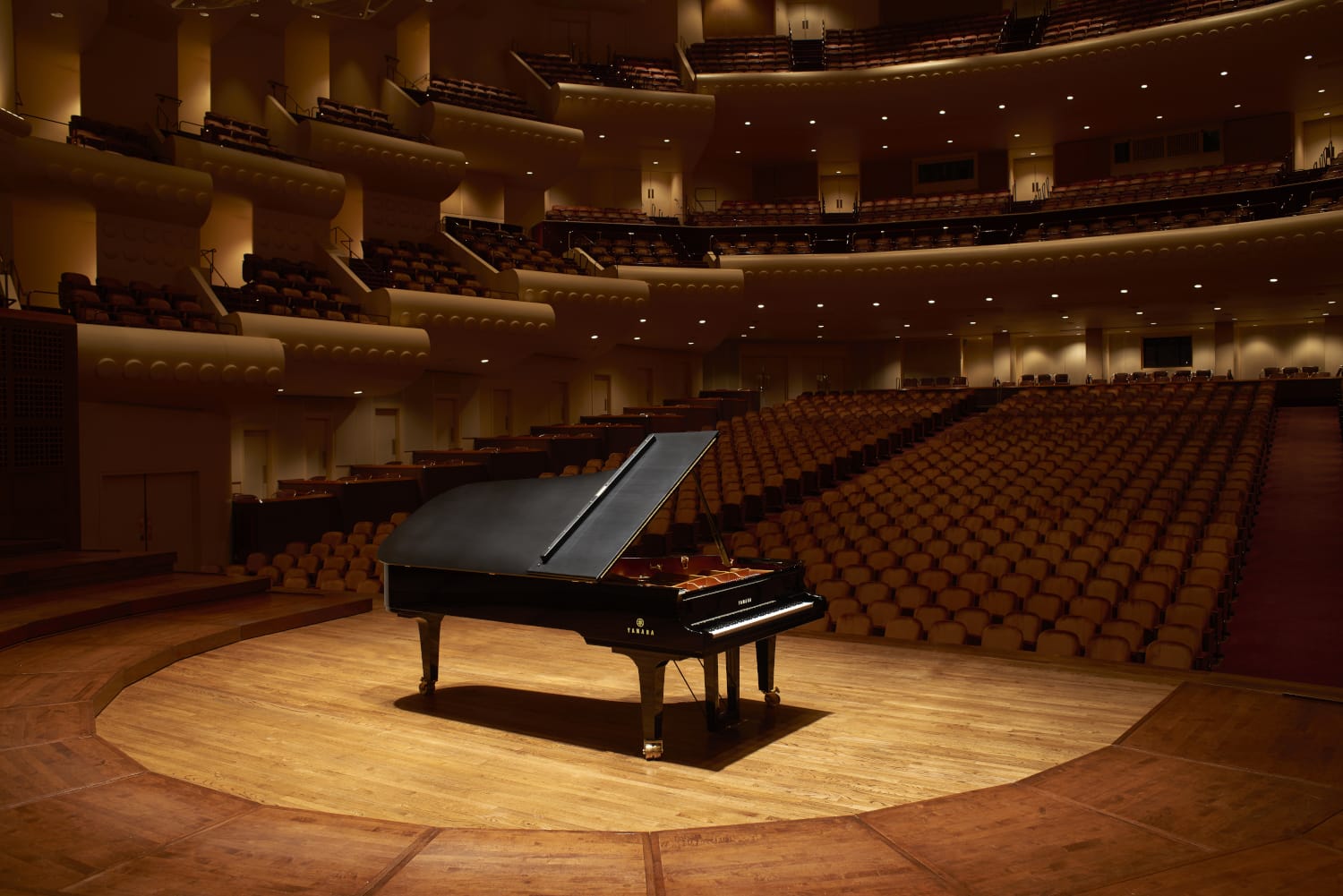 A Yamaha upright with a traditional feel with Queen Anne legs in an eclectically designed living space.