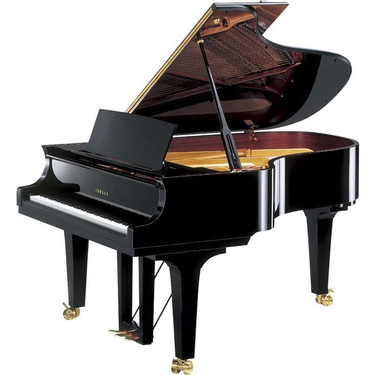 Yamaha grand piano with lid open viewed from right side.