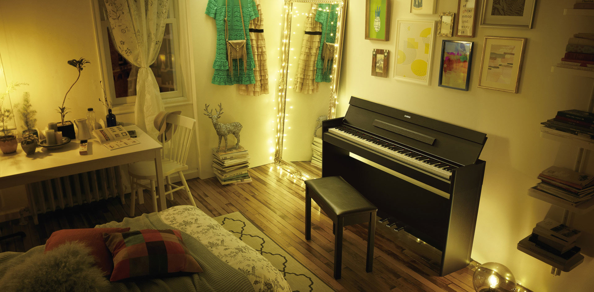 arius piano hero image in a room in a dimlight setting