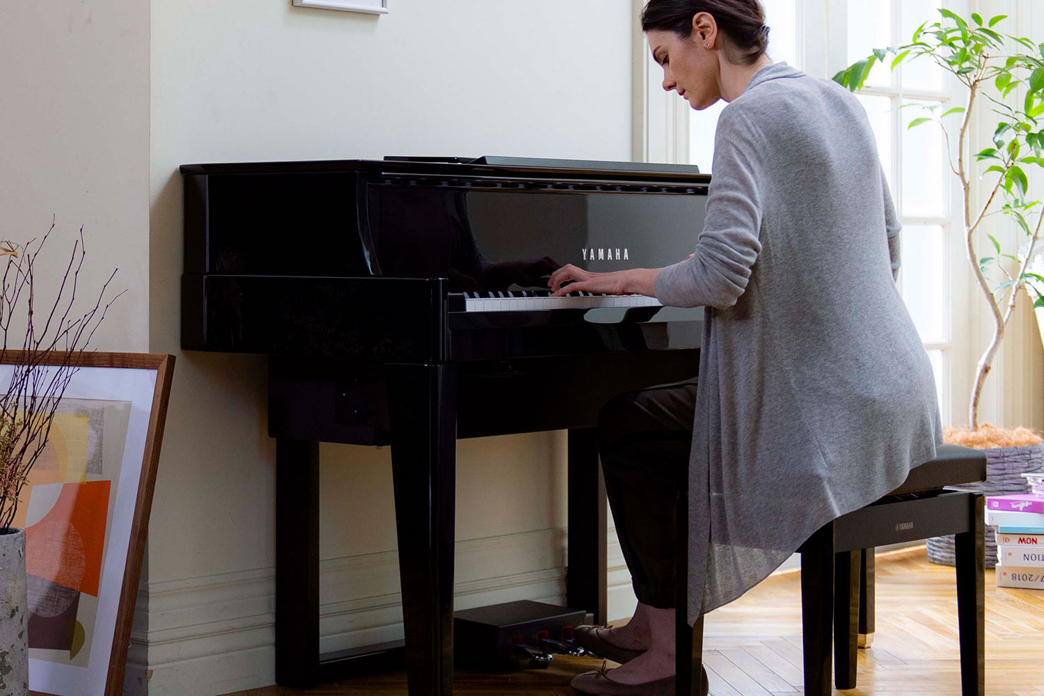 woman playing the avantgrand piano