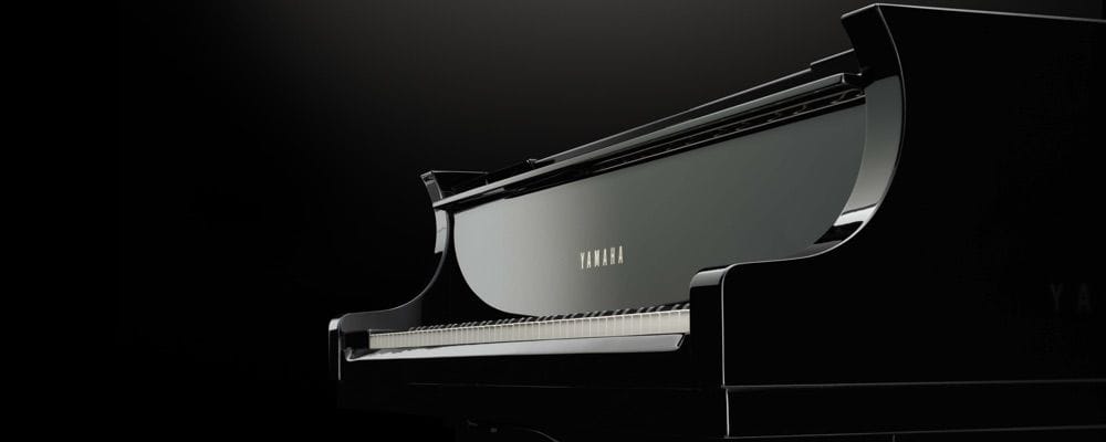 View of a Yamaha grand piano's keyboard.