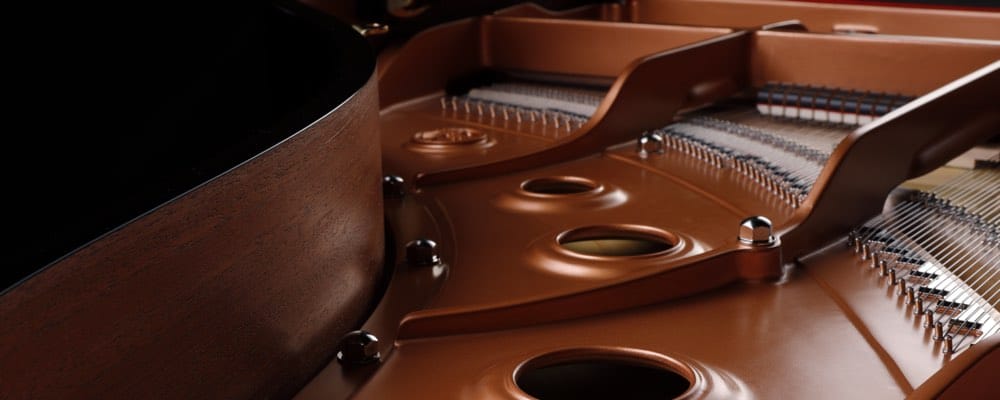 View inside piano showing where the frame meets the board.