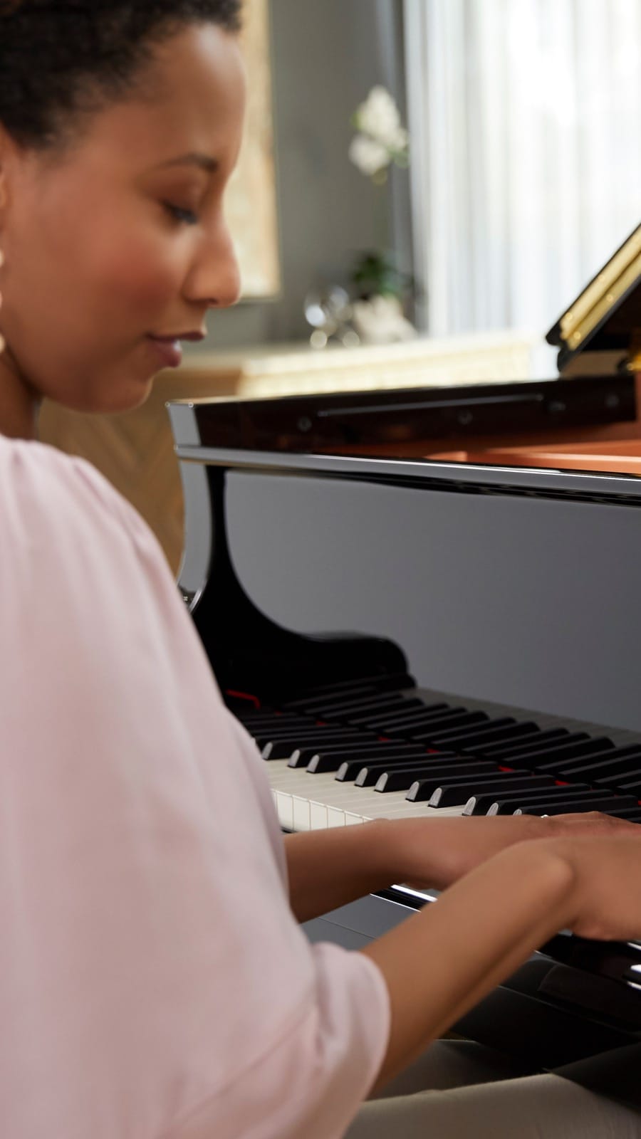 woman playing the piano