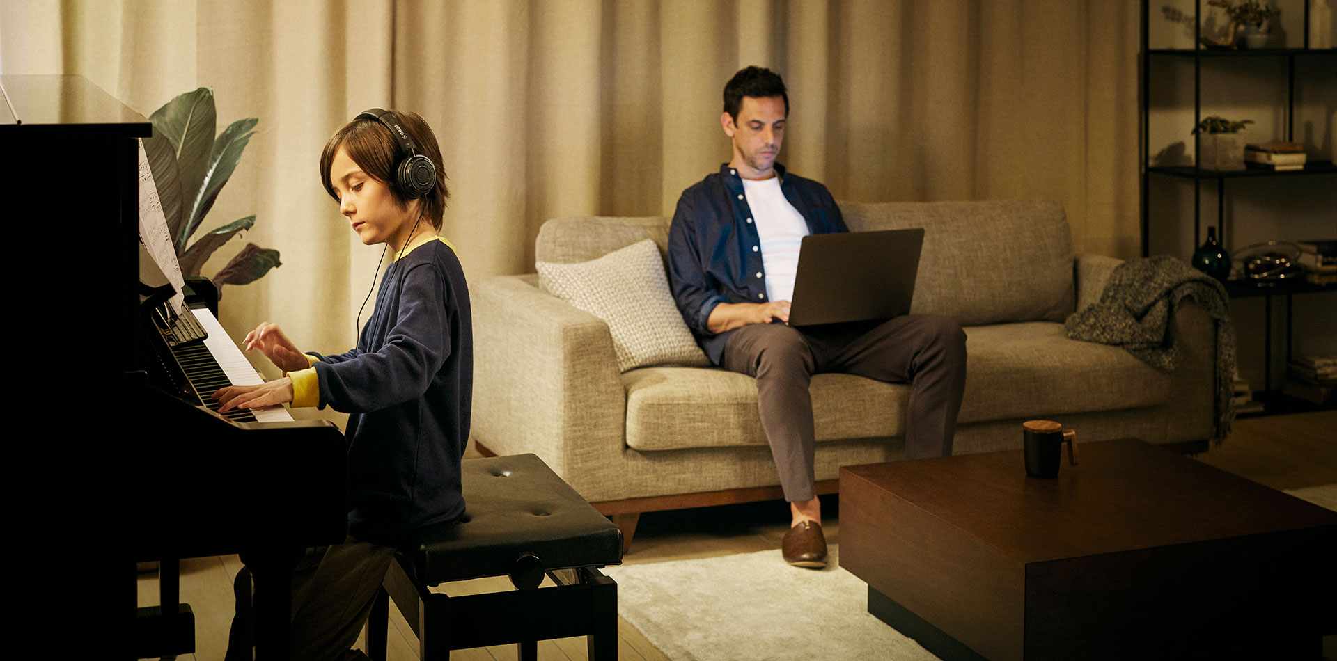 Lifetyle image showing a boy playing silent piano 